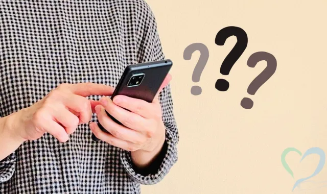 スマホを扱う人と？マーク